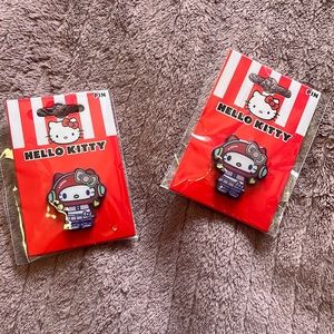 2 hello kitty astronaut pins